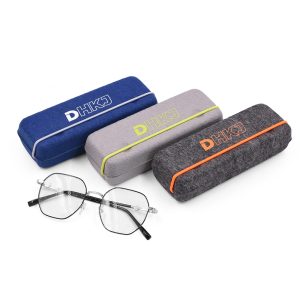 Collection of recycled felt eyeglass cases in blue, grey and dark grey with custom DHKJ logos, paired with eyeglasses, eco-friendly B2B eyewear packaging